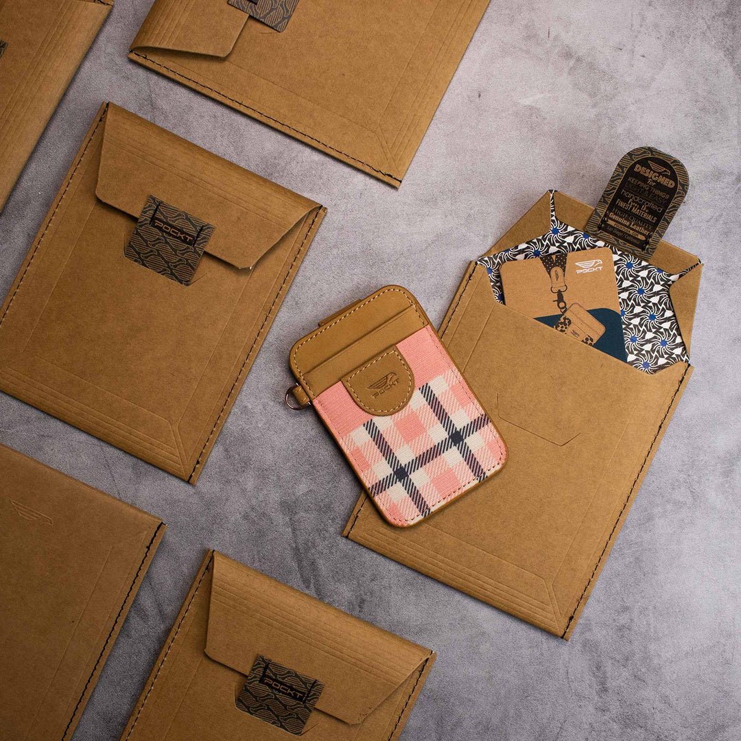 cardboard envelopes with slim credit card holders on the stone background