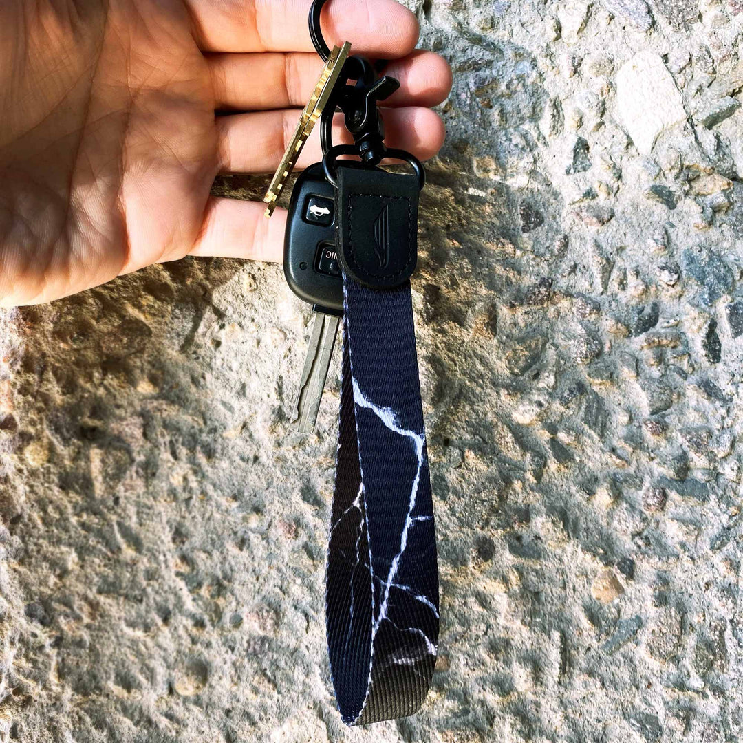 Black white marble wrist lanyard with keys on hand