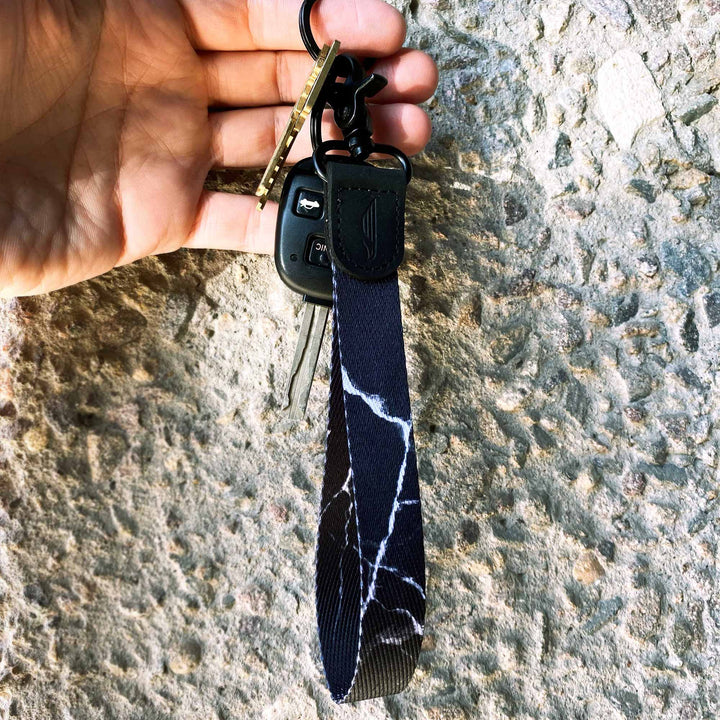 Black white marble wrist lanyard with keys on hand