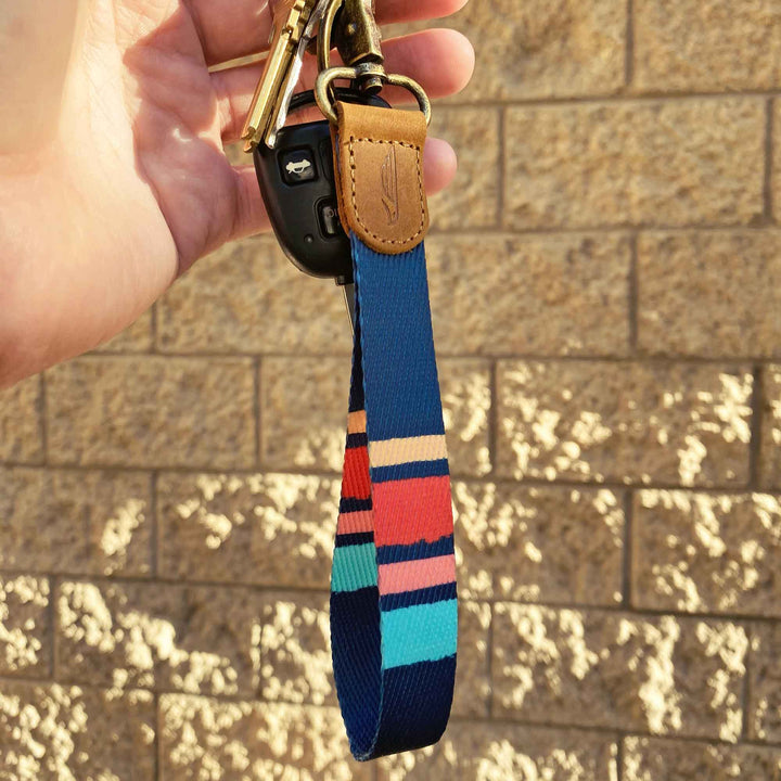 Navy stripe patterned hand wrist lanyard with keys on the hand