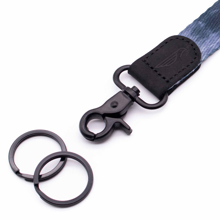 Close up lanyard with 2 black metal key rings black leather navy fabric