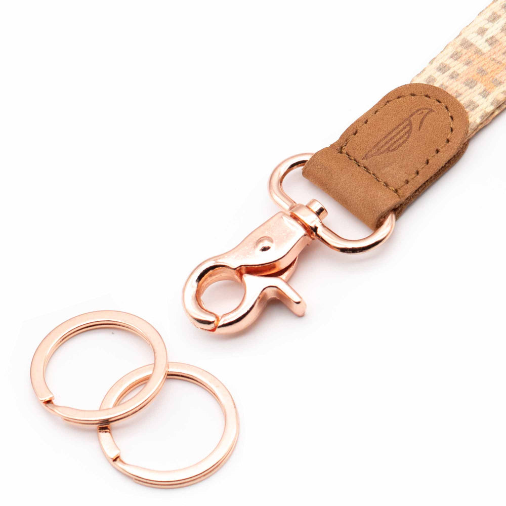 Close up lanyard with 2 rose gold metal key rings brown leather cream fabric