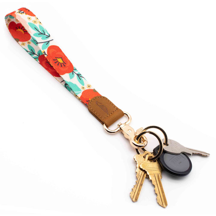 Red blue brown patterned strap keychain gold metal hardware colors with keys