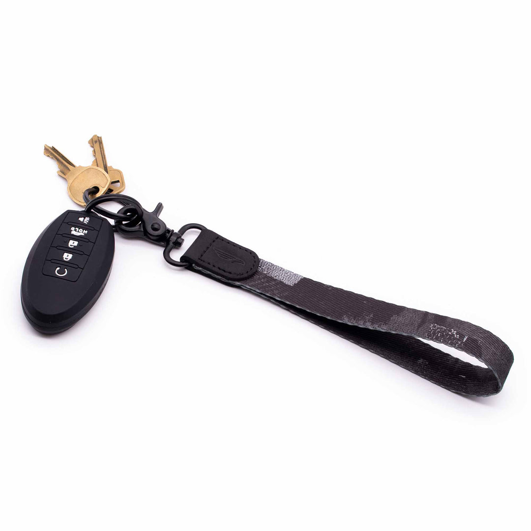 Black gray white hand wrist lanyard with keys and car key